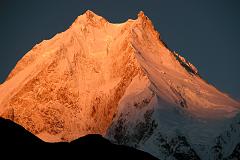 
I waited with anticipation for the sun to rise and hit the mountains. Wow! The subtle changes of the light on Manaslu are terrific, turning from grey to pink to orange to yellow and then to white, all within a few minutes.
